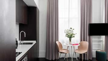 Large Studio Apartment | Premium bedding, in-room safe, laptop workspace, blackout drapes