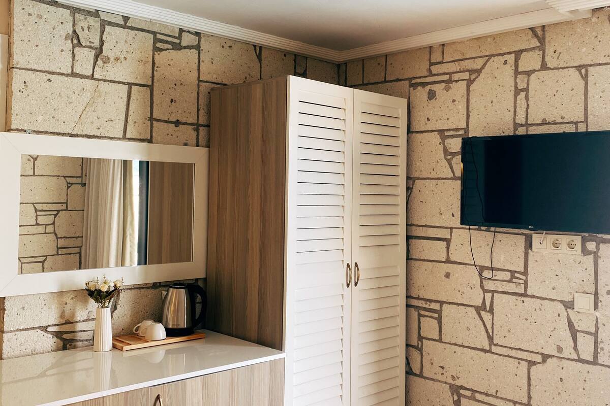 Minibar, desk, laptop workspace, iron/ironing board