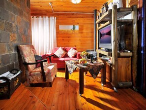 Deluxe Cabin, 1 King Bed, Private Pool | Living area | 40-inch LCD TV with satellite channels, TV, fireplace