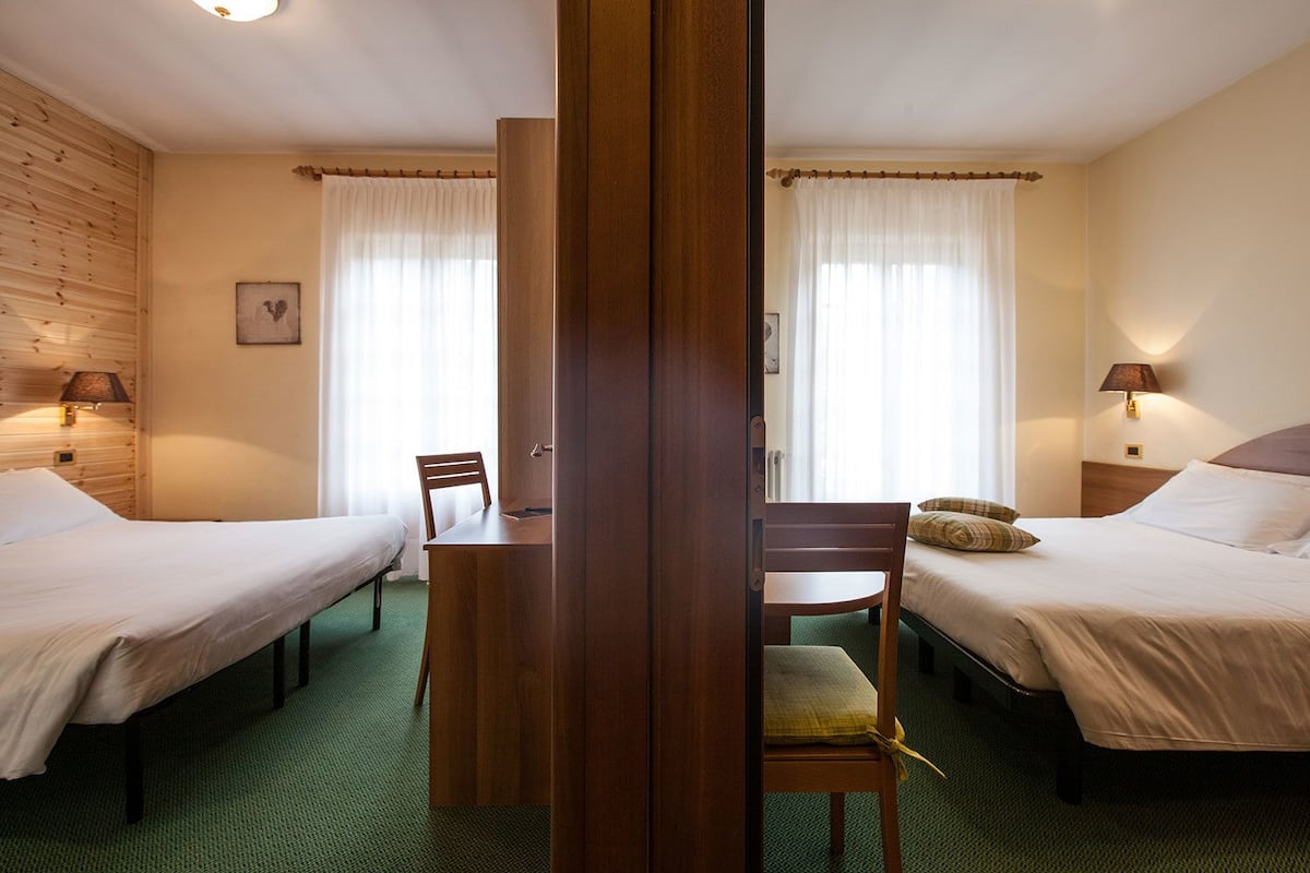 Quadruple Room | 1 bedroom, in-room safe, desk, free cribs/infant beds