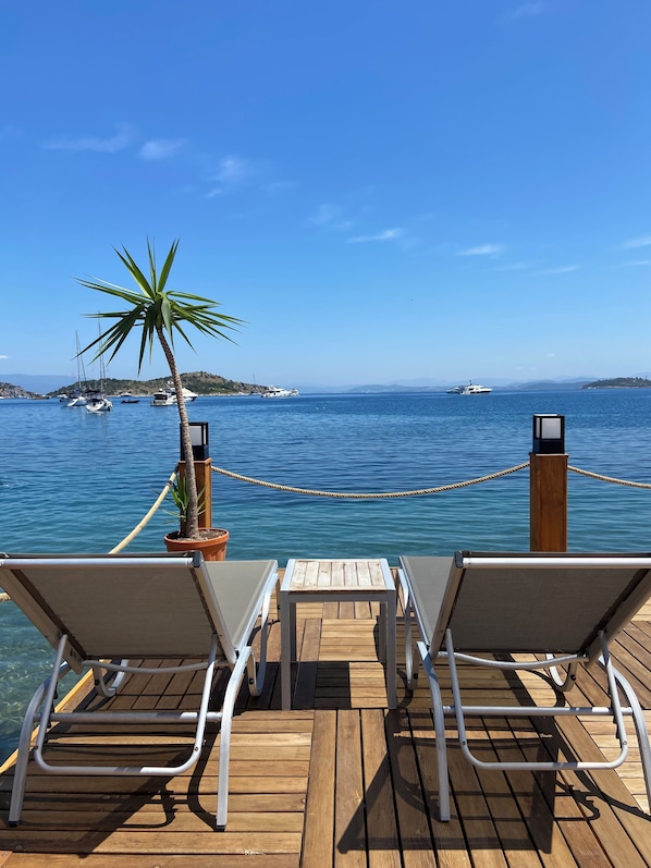 Private beach, free beach shuttle, free beach cabanas, sun loungers