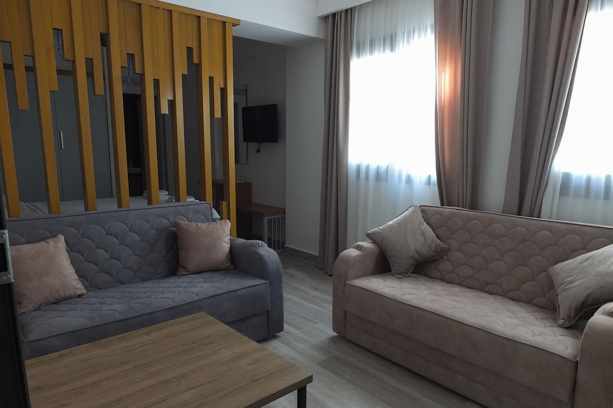 Comfort Quadruple Room, Corner | Living area | LCD TV