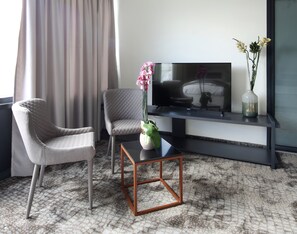 Classic Double or Twin Room, 1 Bedroom | Living room | 1-inch LCD TV with cable channels, TV, fireplace - Koncept Residence Hotel (Sarajevo)