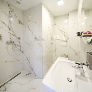 Shower, free toiletries, hair dryer, slippers