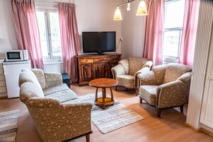 Apartamento, 2 quartos, cozinha | Área de estar