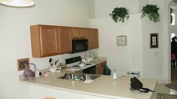 Villa | Private kitchen | Full-sized fridge, microwave, oven, stovetop