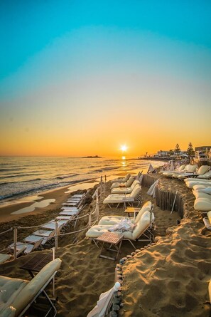 On the beach, sun-loungers, beach umbrellas - Parthenis Beach Suites by the Sea (Hersonissos)