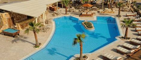 Outdoor pool, pool umbrellas, sun loungers