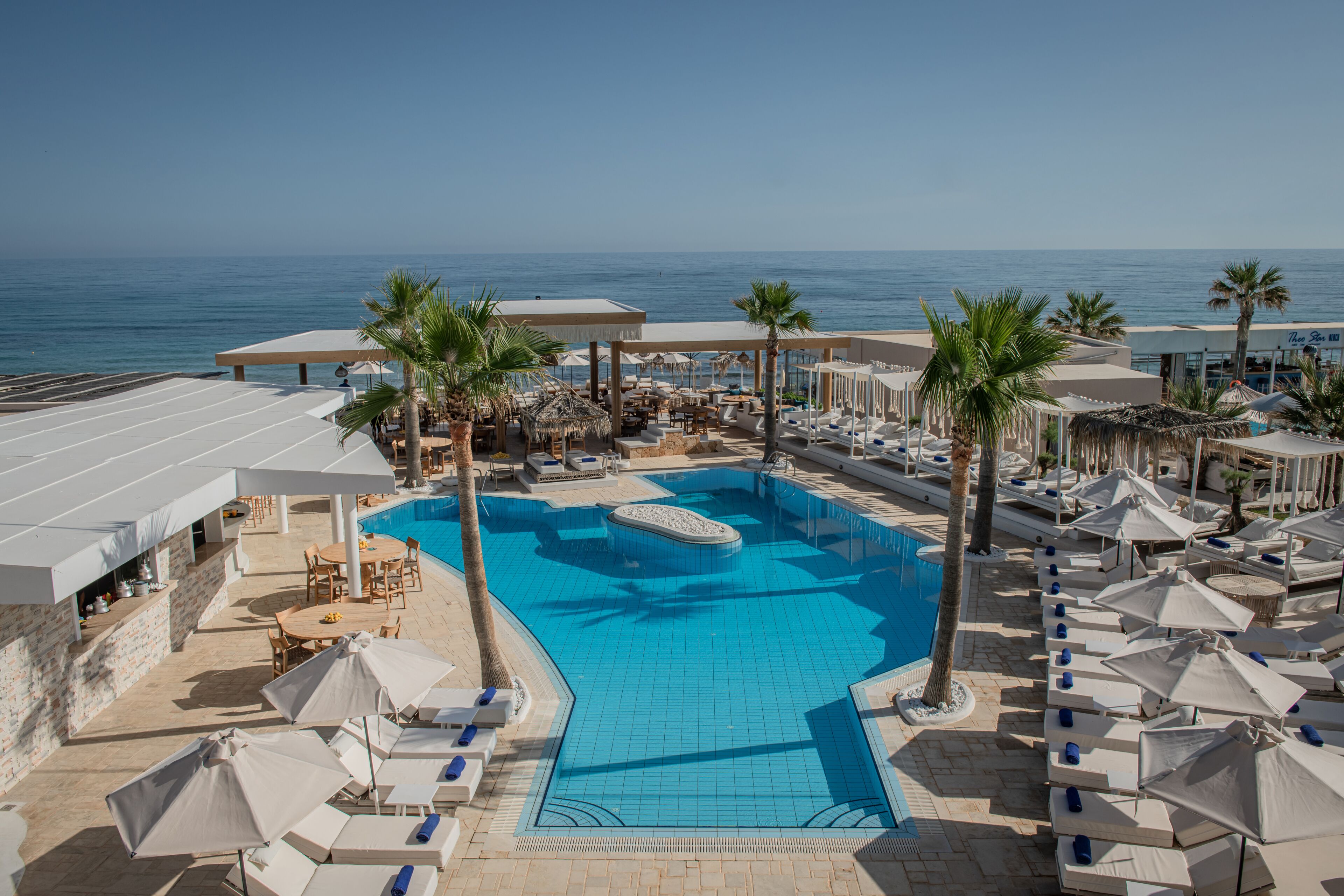 Seasonal outdoor pool, open 8:00 AM to 8:00 PM, pool umbrellas