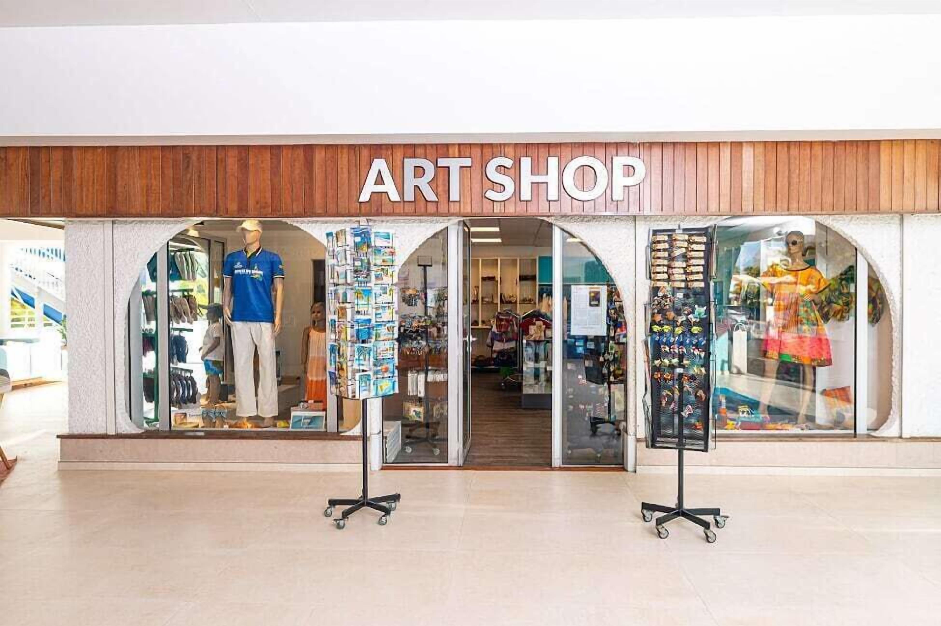 An art shop with a wooden facade and glass display windows.