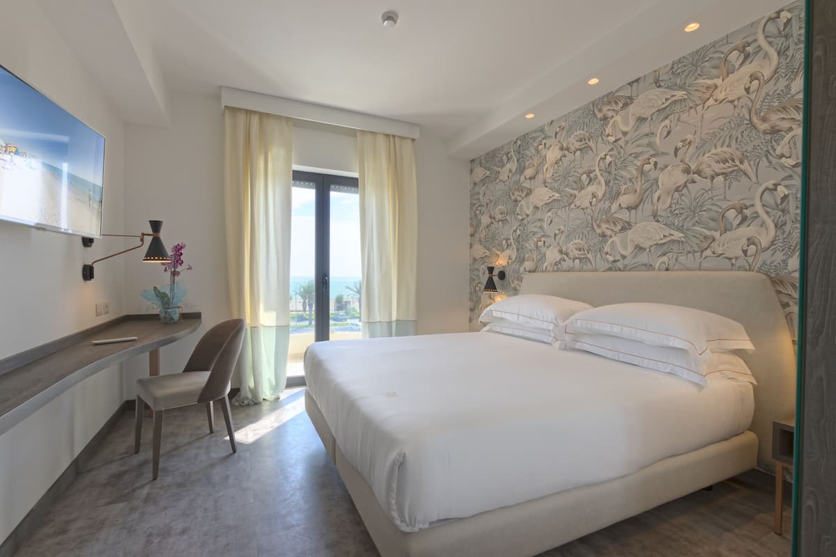Deluxe Triple Room, Non Smoking, Sea View | 1 bedroom, premium bedding, minibar, in-room safe