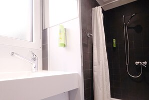 Shower, eco-friendly toiletries, hair dryer, towels