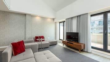 Deluxe Apartment, 4 Bedrooms, Terrace | Living area | Flat-screen TV