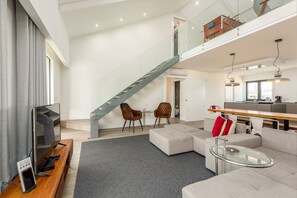 Deluxe Apartment, 4 Bedrooms, Terrace | Living area | Flat-screen TV