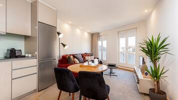 Deluxe Apartment, 1 Bedroom, Balcony (3) | Living area | Flat-screen TV