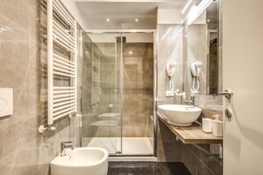 Shower, free toiletries, hair dryer, slippers
