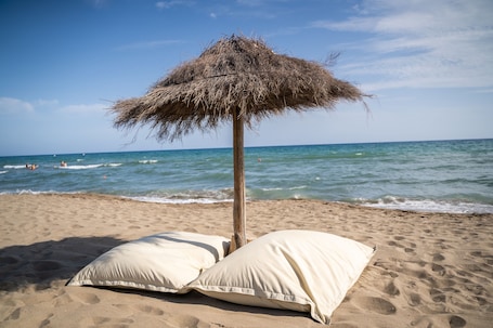Private beach, sun loungers, beach umbrellas, windsurfing