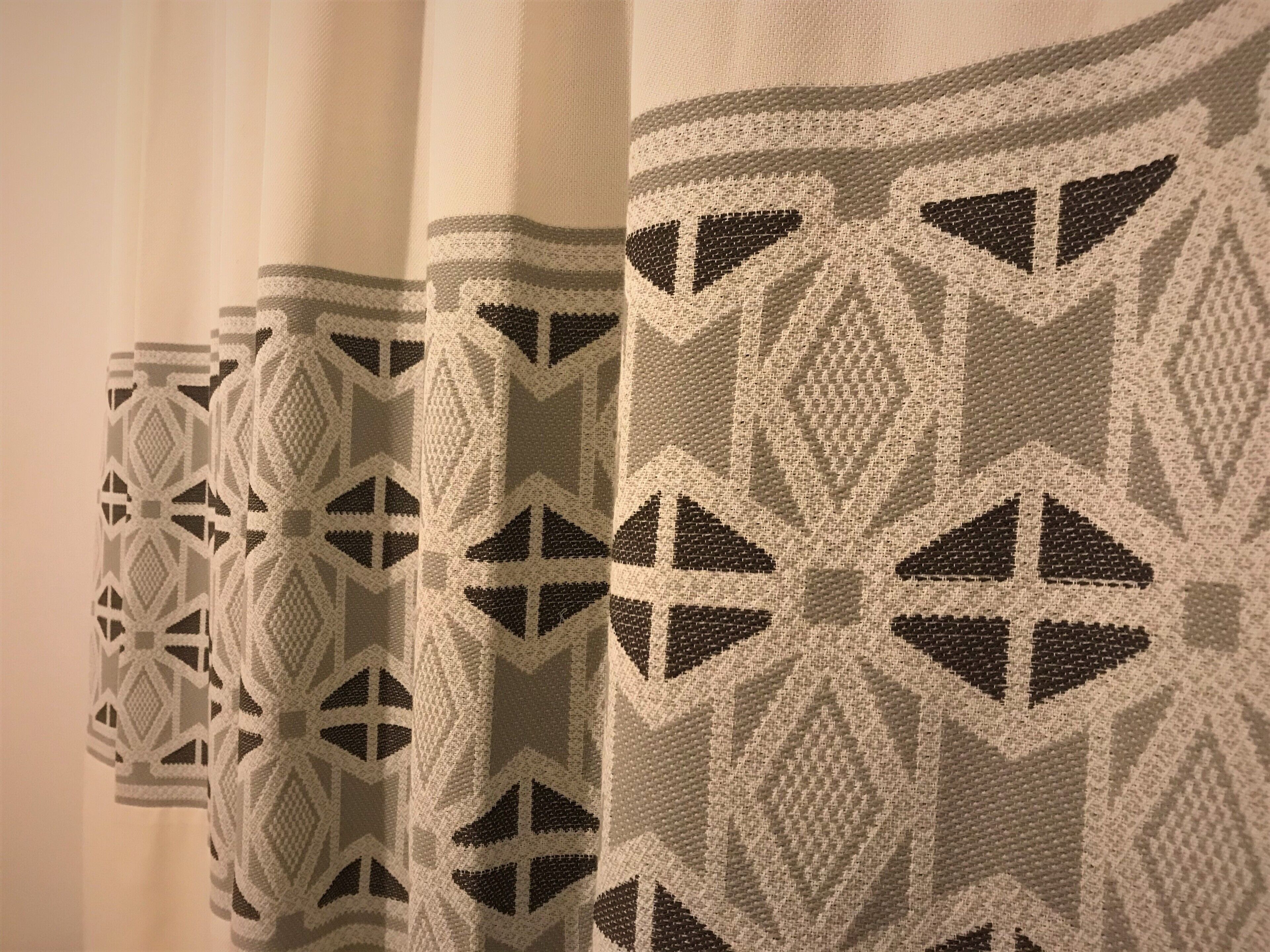 A series of curtains with geometric patterns.