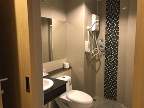 A modern bathroom with a toilet, sink, and shower. - The Royal Ville Residence (Kabin Buri)