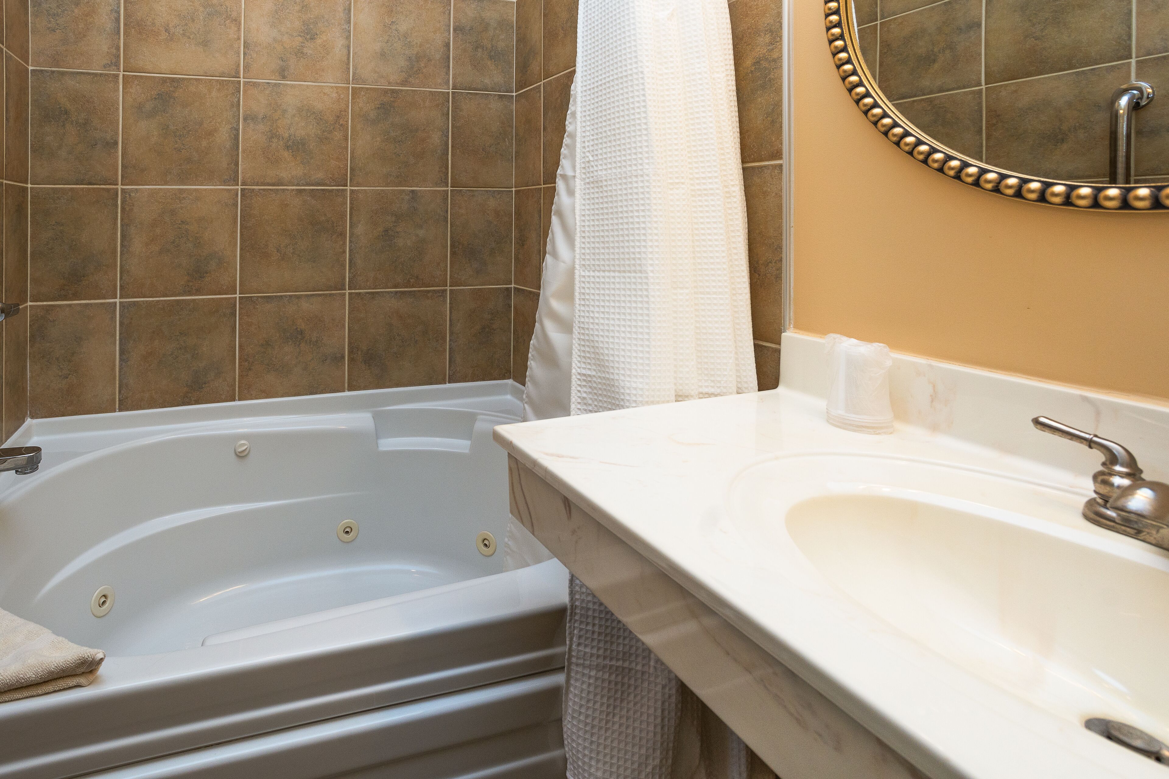 queen/jacuzzi suite 23 (end unit/deck water view) | bathroom | hair dryer, towels, soap, shampoo