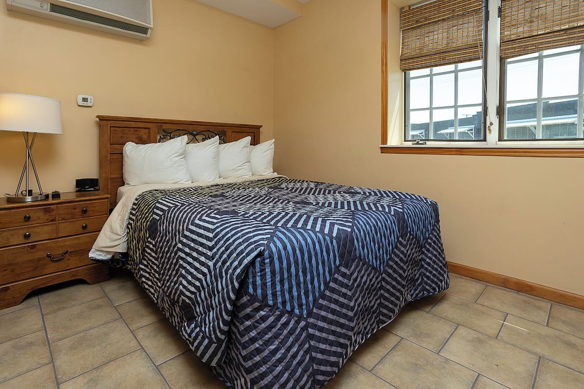 Hypo-allergenic bedding, desk, blackout drapes, iron/ironing board