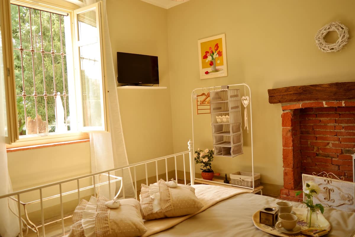Habitación familiar, varias camas, baño privado, vistas al jardín | Vistas al jardín