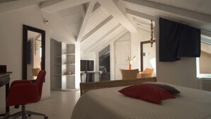 A bedroom with a large bed, a chair, a desk, and a mirror. - Residenza D'Epoca 1861 (Castellabate)