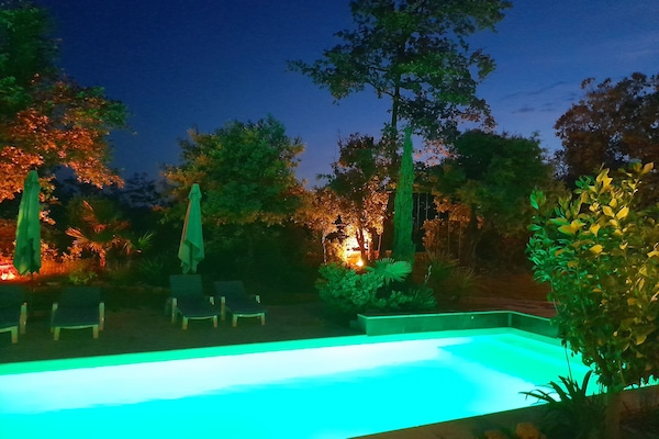 Seasonal outdoor pool, a waterfall pool, pool umbrellas, pool loungers