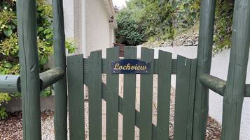 A wooden gate with a sign that reads "Lachview."