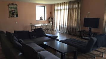 Standard Room, Multiple Bedrooms | Living area | TV