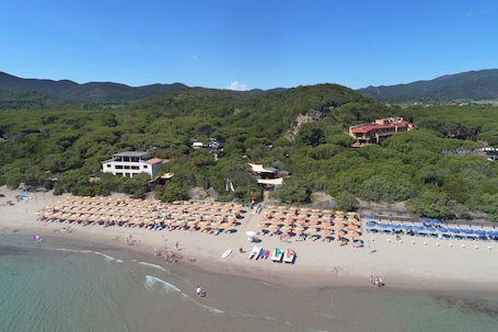 Private beach, white sand, sun loungers, beach umbrellas