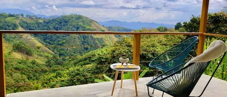 Bungalow, Garden View | Desk, bed sheets