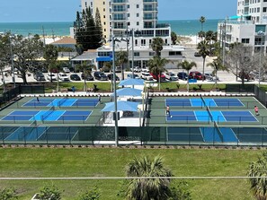 Enjoy tennis on our outdoor courts surrounded by lush greenery and ocean views.