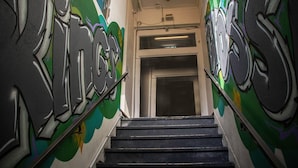 A staircase with graffiti on the walls. - Hump Backpackers (Potts Point)