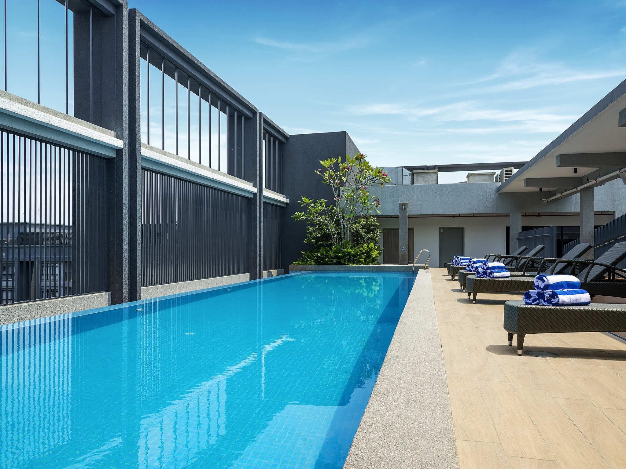 Outdoor pool, open 7:00 AM to 7:00 PM, pool umbrellas, pool loungers