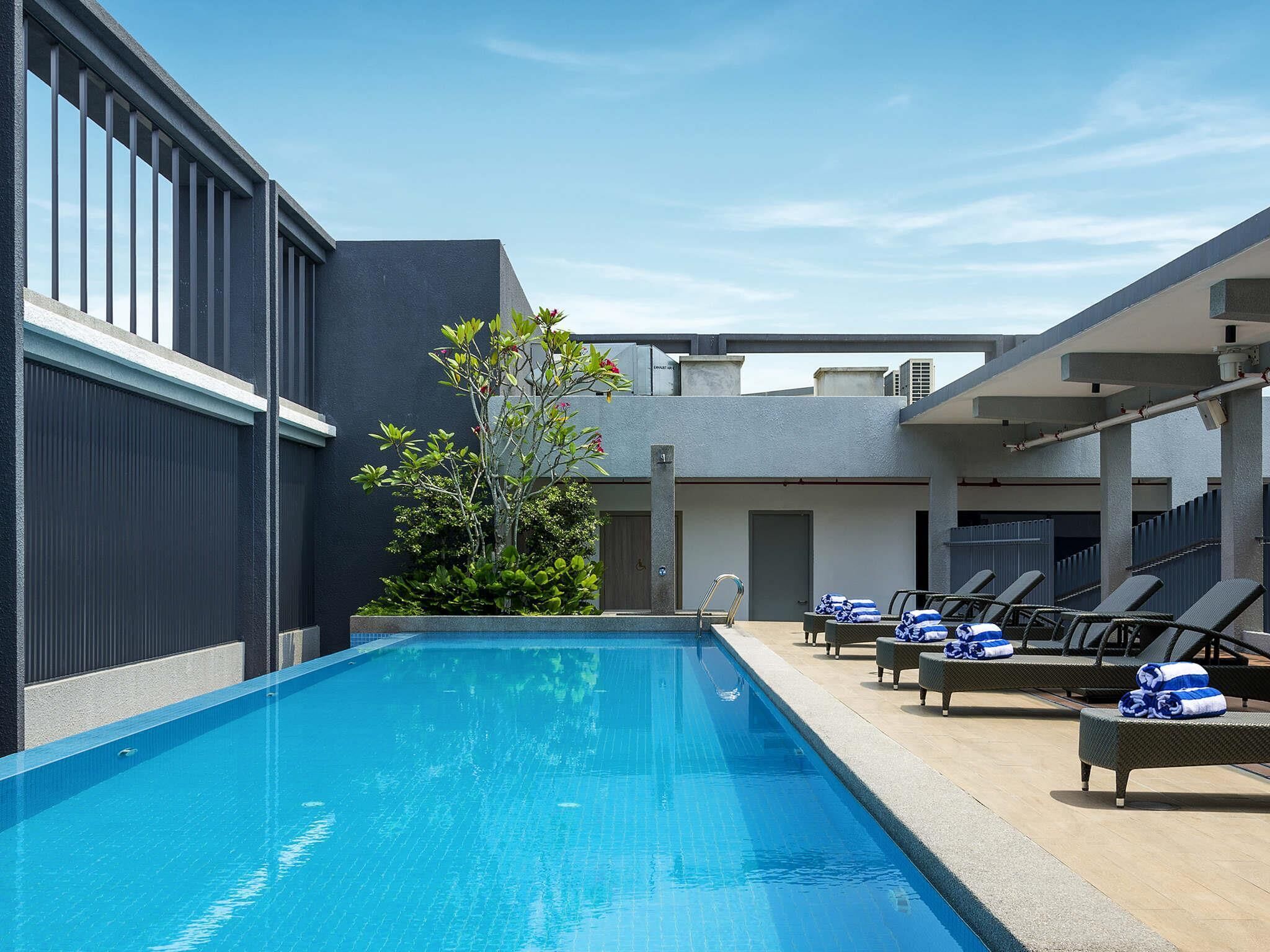 Outdoor pool, open 7:00 AM to 7:00 PM, pool umbrellas, sun loungers