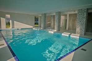 Indoor pool, open 9:00 AM to 10:00 PM, pool loungers