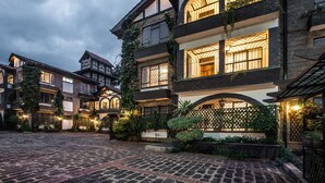 A historic building with multiple arches and a courtyard. - The Grand Gables (Nairobi)