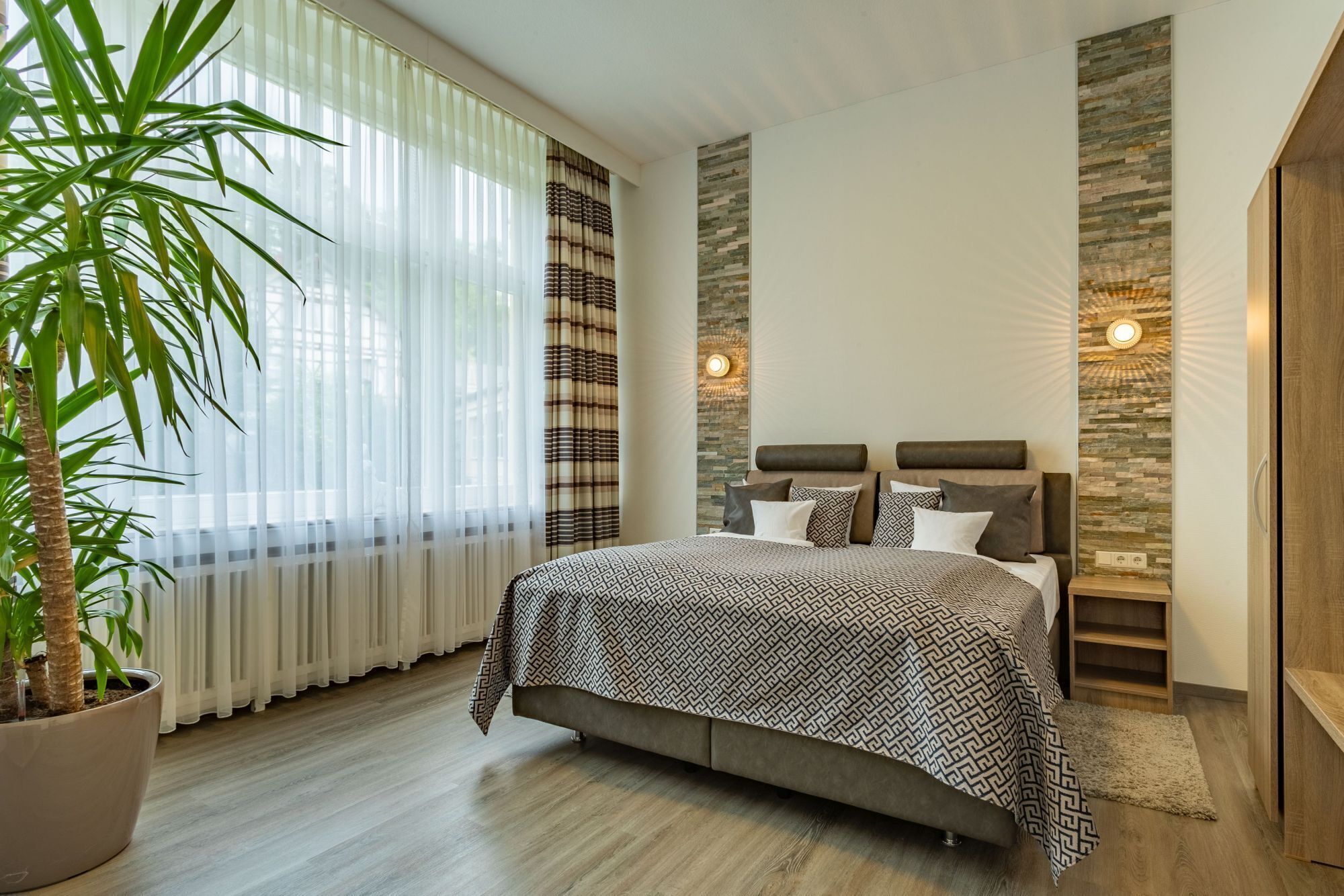 luxury suite | in-room safe, desk, blackout curtains, iron/ironing board