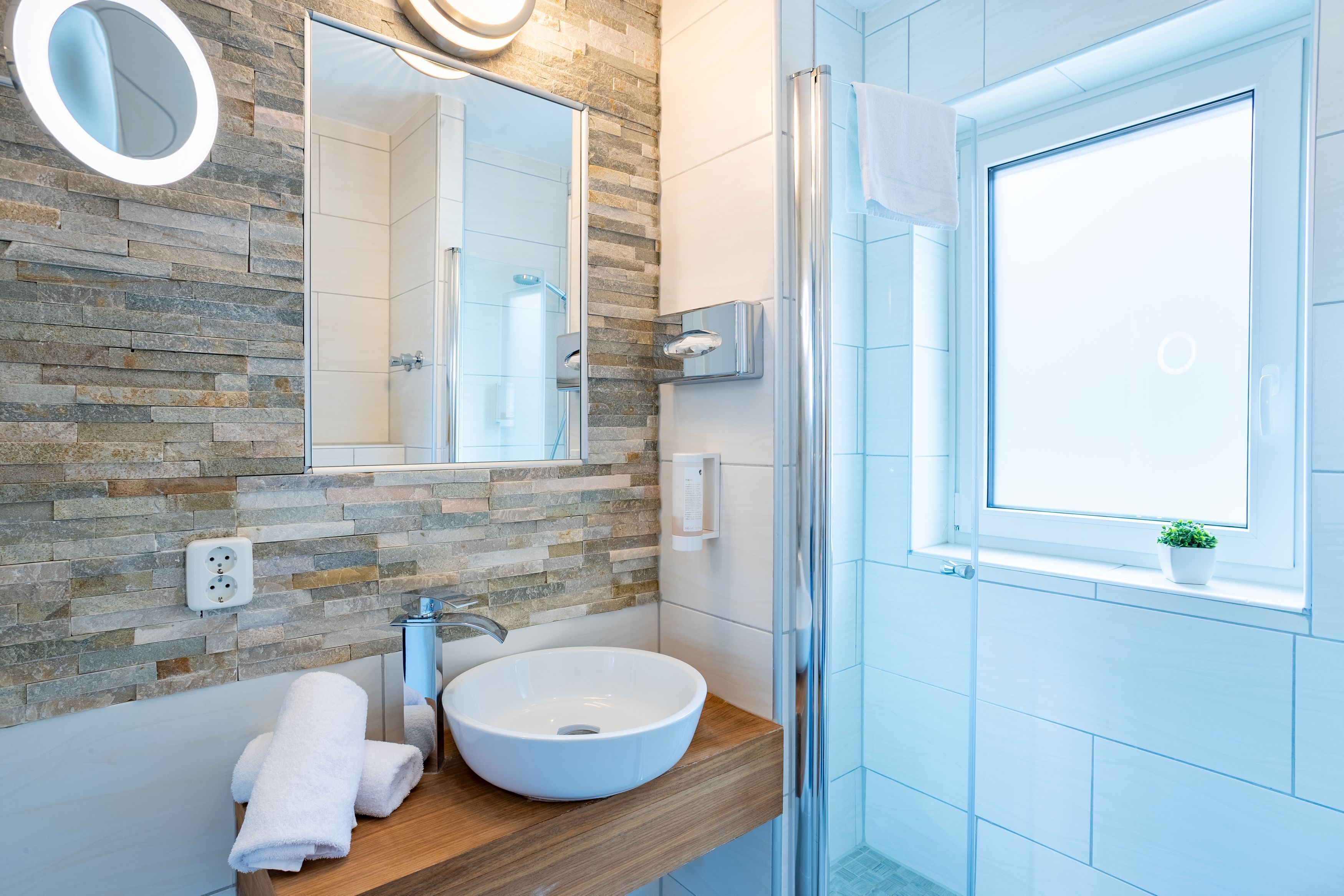 shower, hair dryer, bathrobes, towels