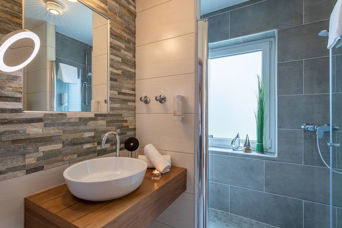 shower, hair dryer, bathrobes, towels