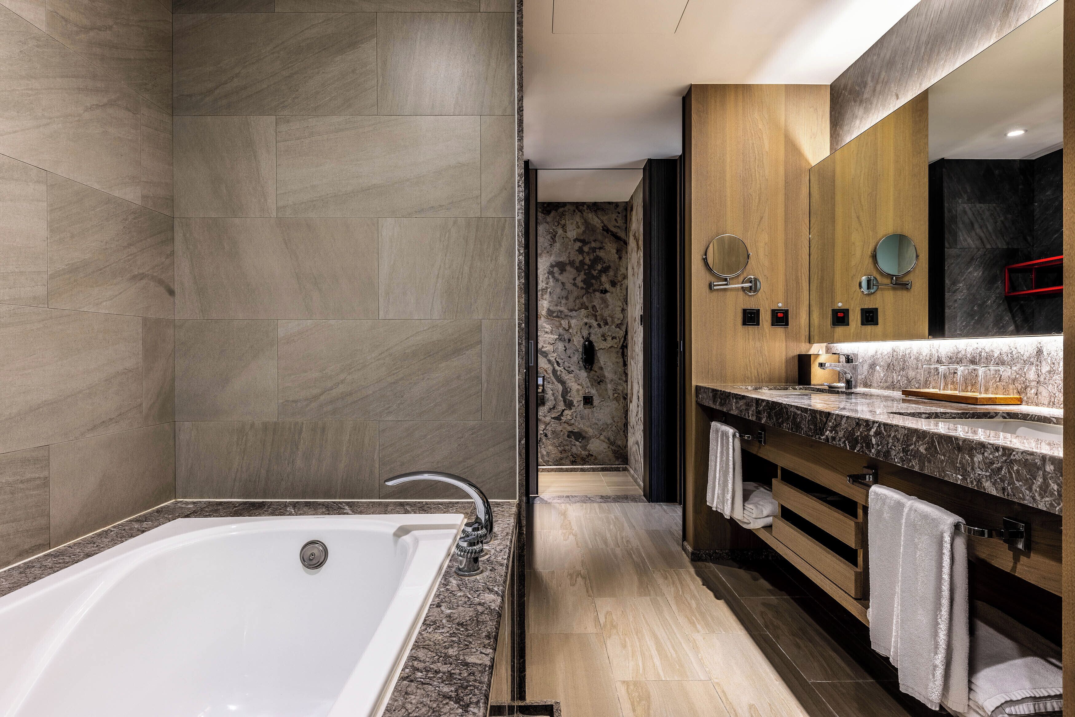 executive suite | bathroom | eco-friendly toiletries, hair dryer, slippers, electronic bidet