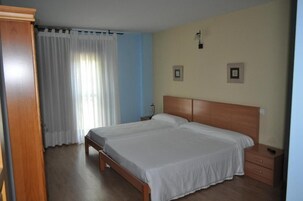 Desk, blackout drapes, rollaway beds, free WiFi