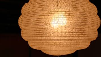 A close-up of a textured, cylindrical light fixture.