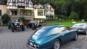 A classic car parked in front of a hotel restaurant with a traditional European architectural style. - Moselhotel Restaurant Peifer (Brodenbach)