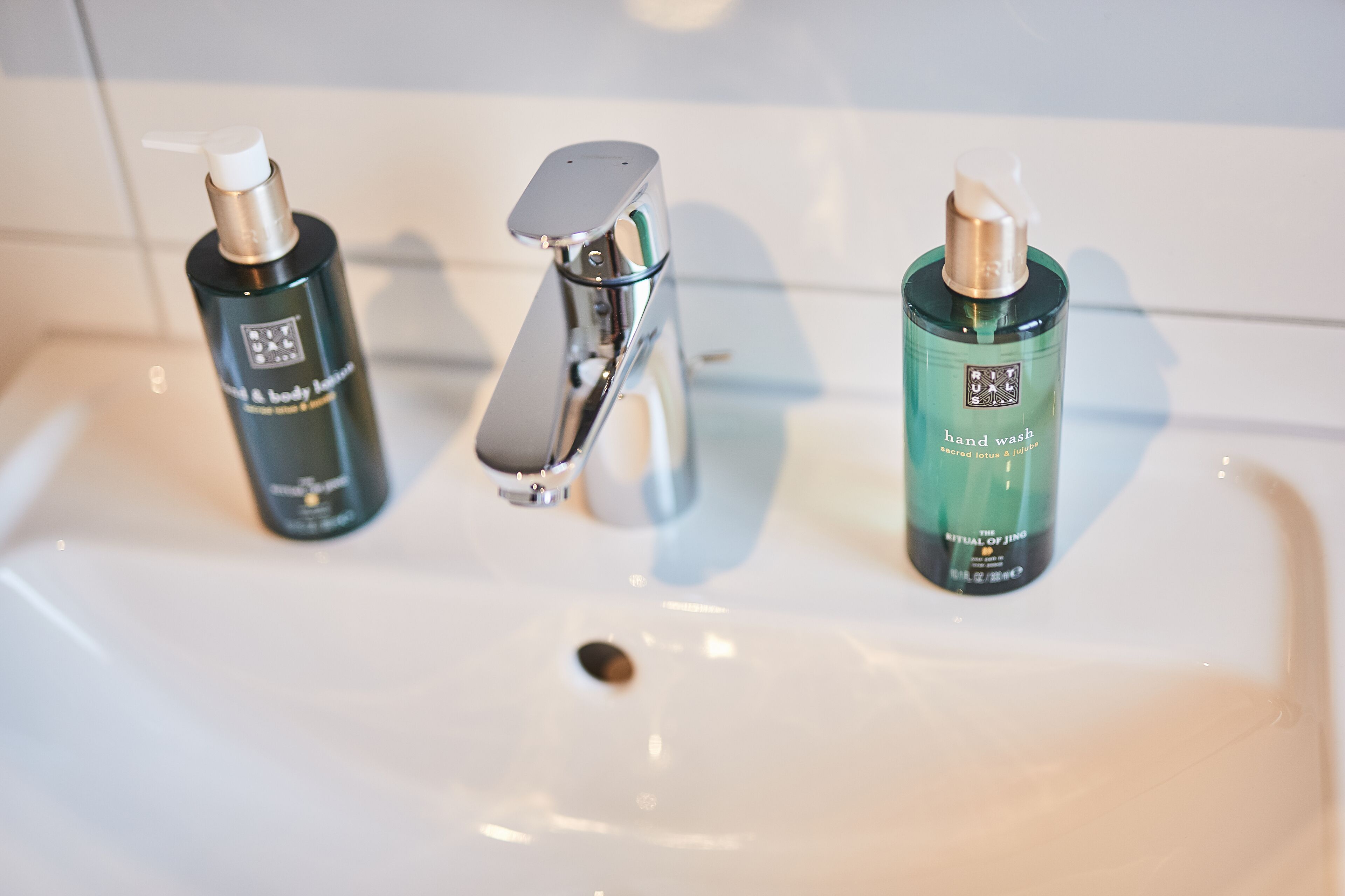 shower, designer toiletries, hair dryer, towels