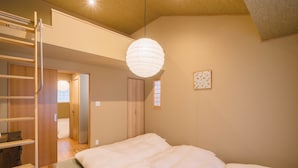 A bedroom with a bed, a ladder, a hanging light fixture, and a small window. - Miro Sanjo Saiin Tei (Kyoto)