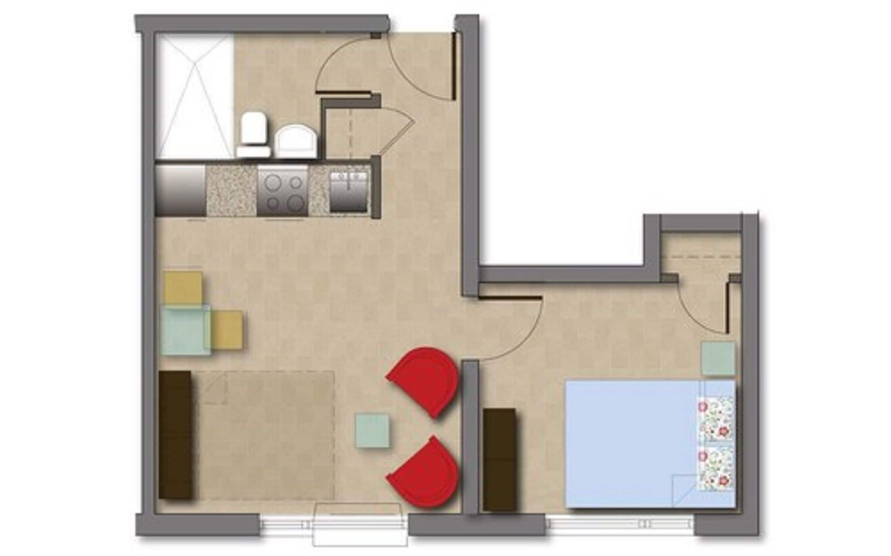 A floor plan of a hotel room with a kitchenette, a seating area with two red chairs, a small table, and a bed.