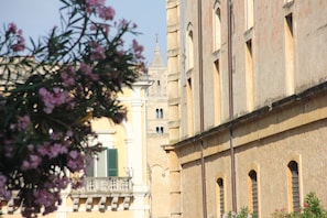 A historic building with a bell tower and arched windows. - Matera Guest House (Matera)