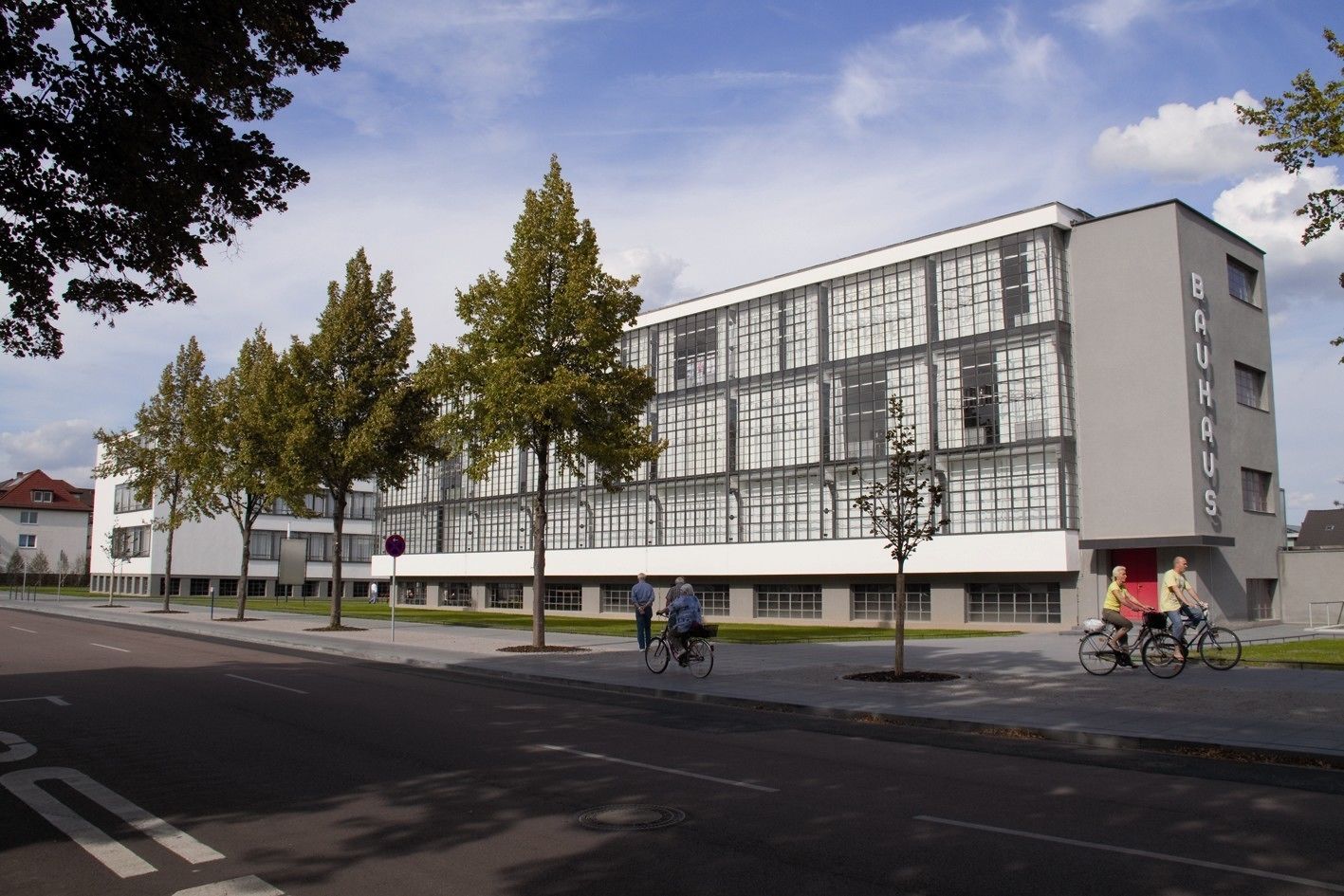 A modern building with a glass facade, a flat roof, and a sign reading "BAUHAUS".